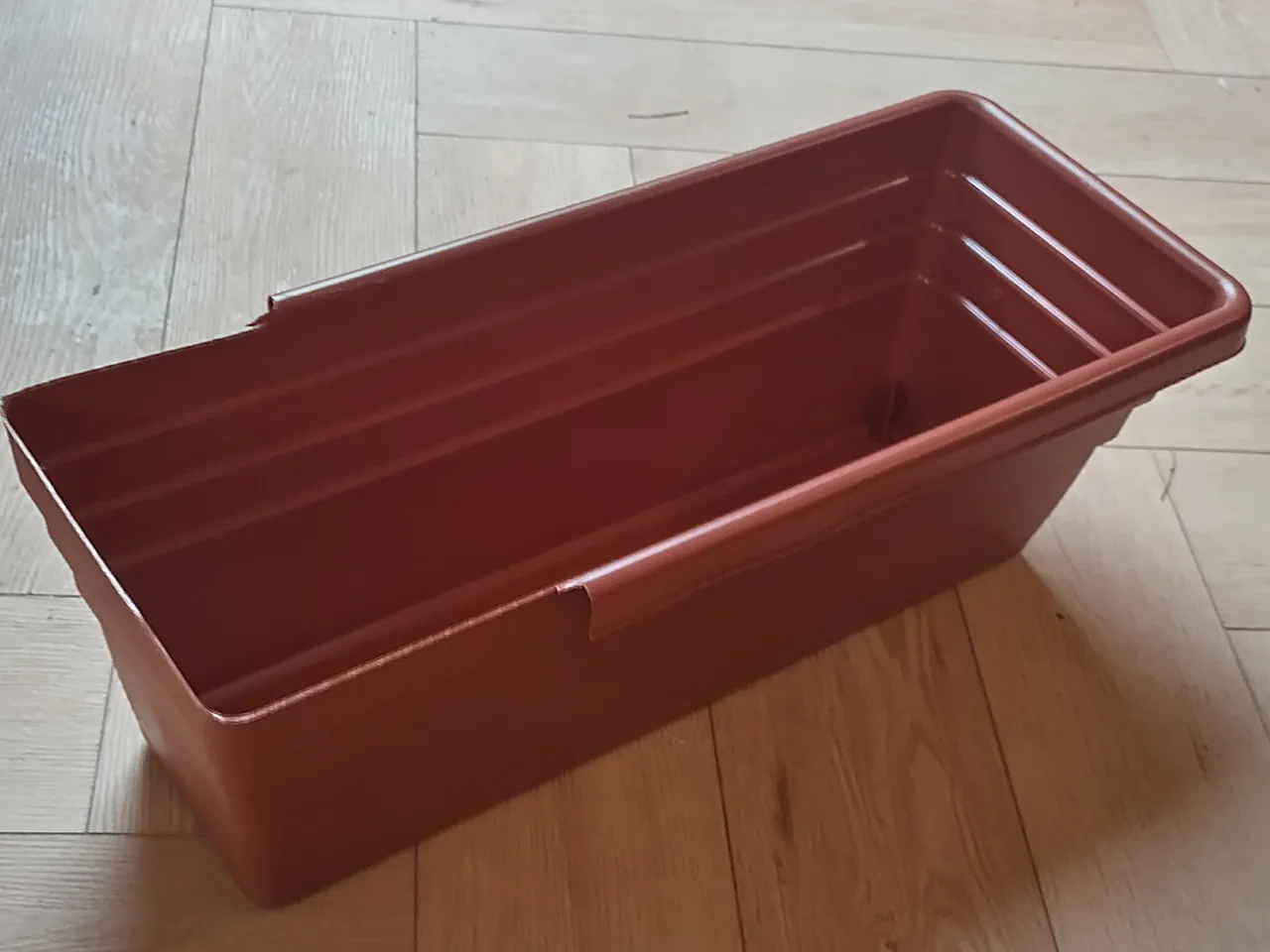 The trough viewed from above before trimming, with horizontal ridge lines visible along the sides