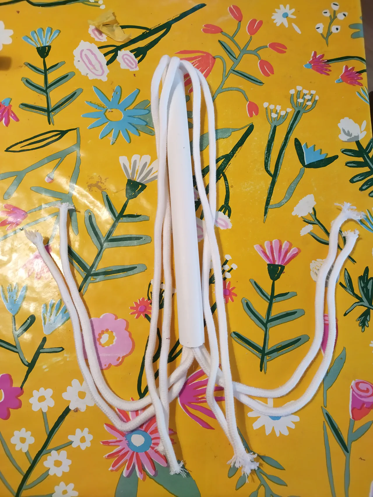 Wicking rope threaded through the PVC pipe, showing how the strands loop down and back up